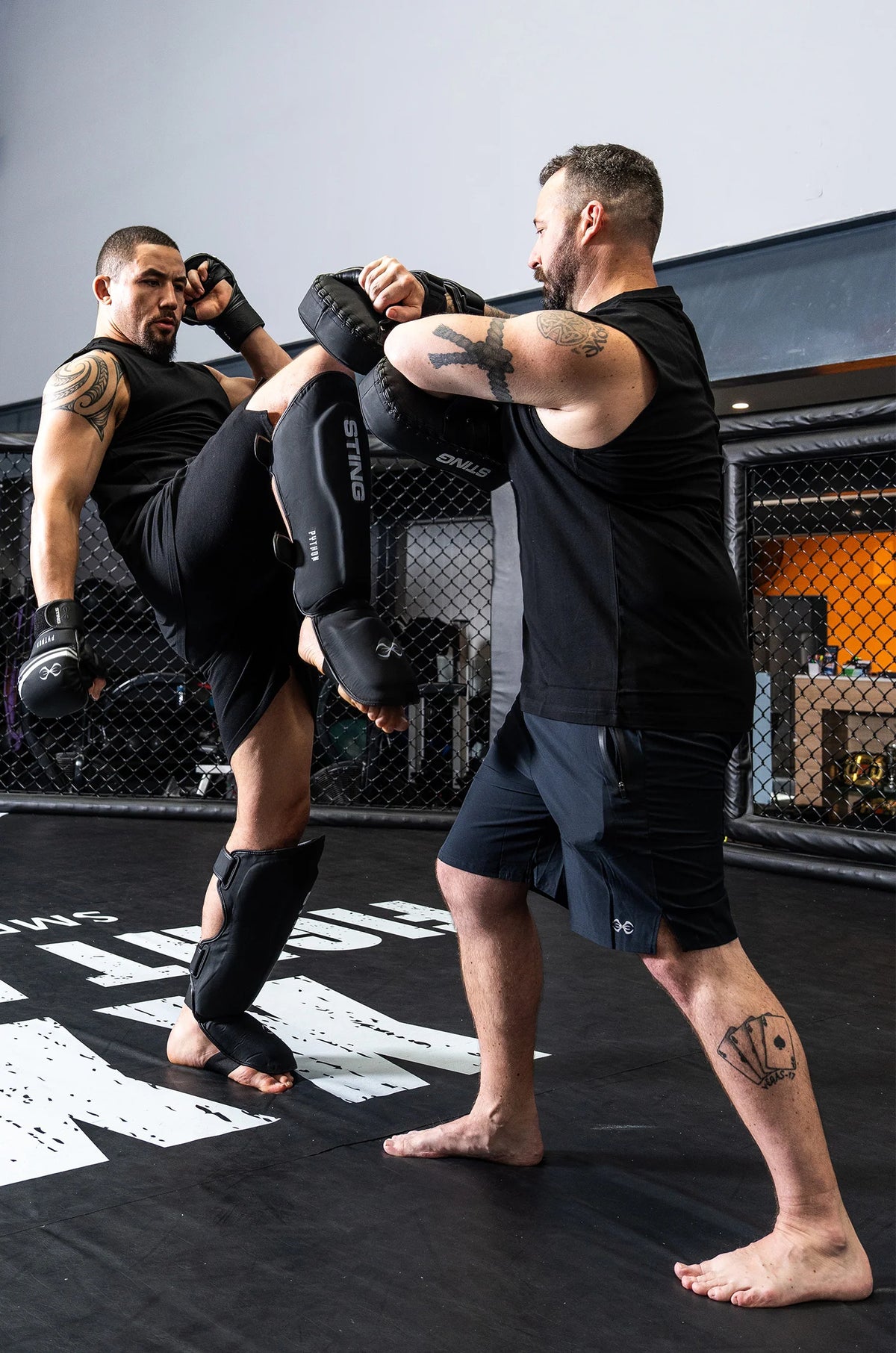 Robert Whittaker UFC Fighter practicing martial arts on a mat with Sting Sports protective gear.