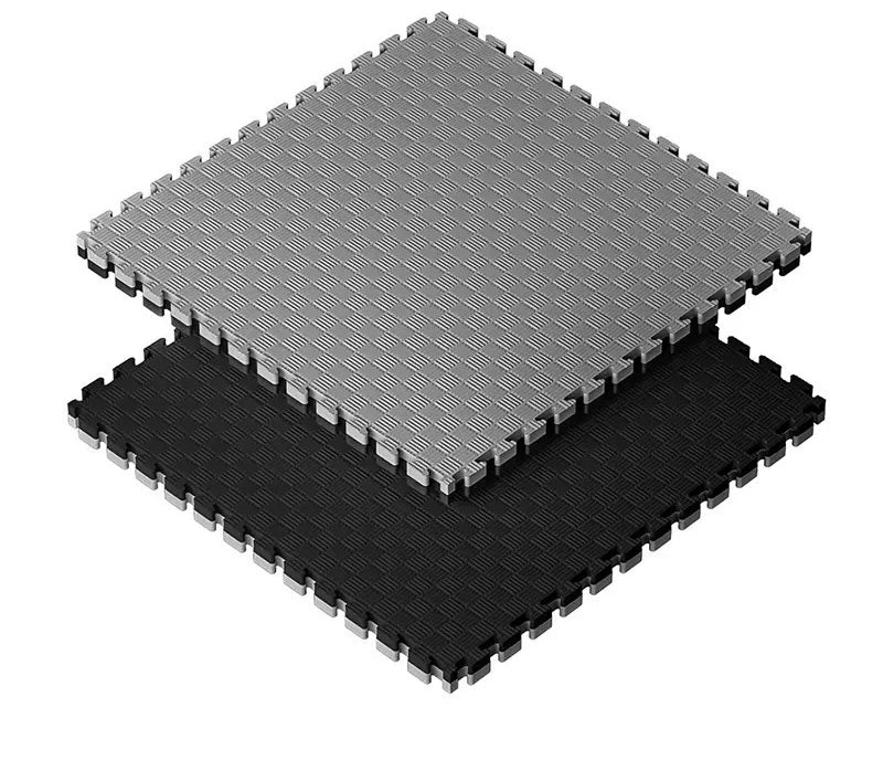 Gray and black interlocking foam mats on a white background