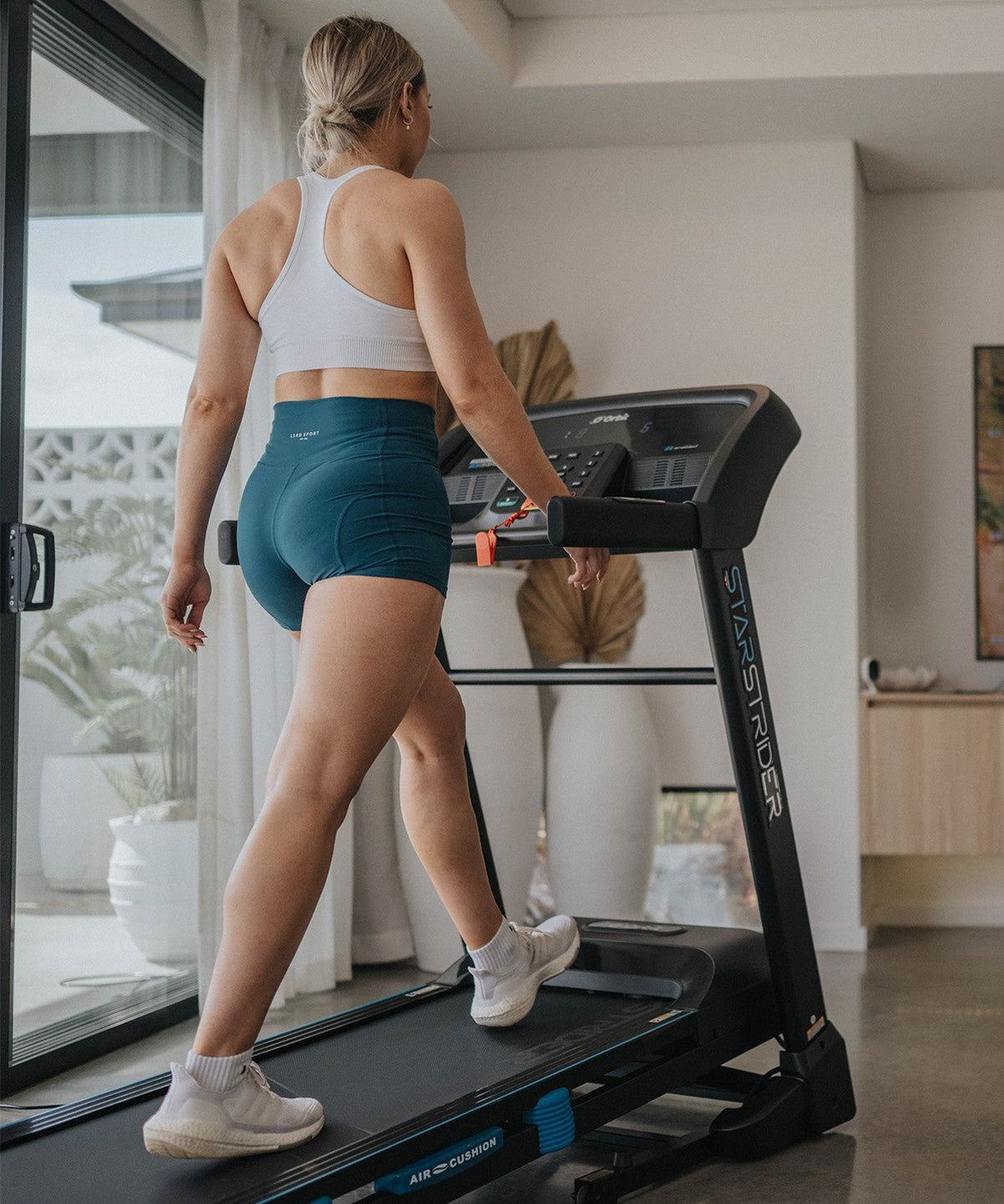 Foldable StarStrider SS55C Treadmill with compact design for home storage