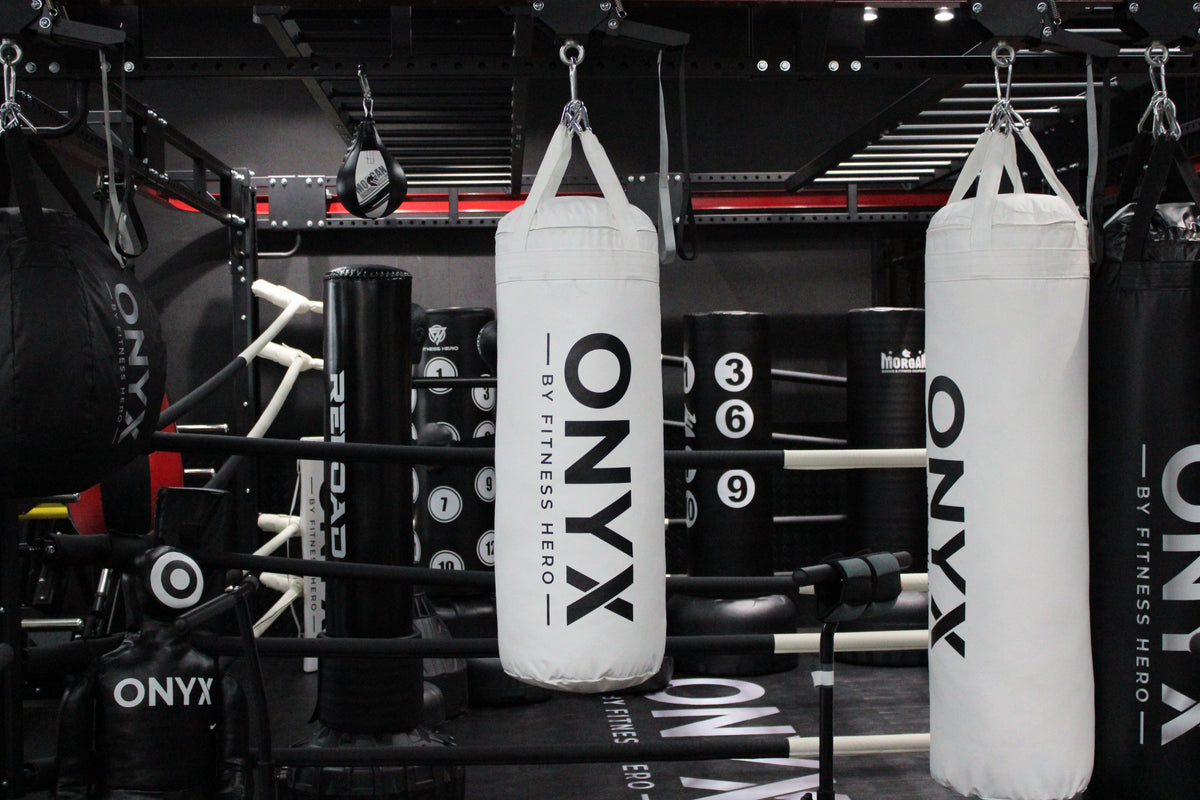 Onyx Premium Boxing Bag in white - hanging by reinforced nylon straps