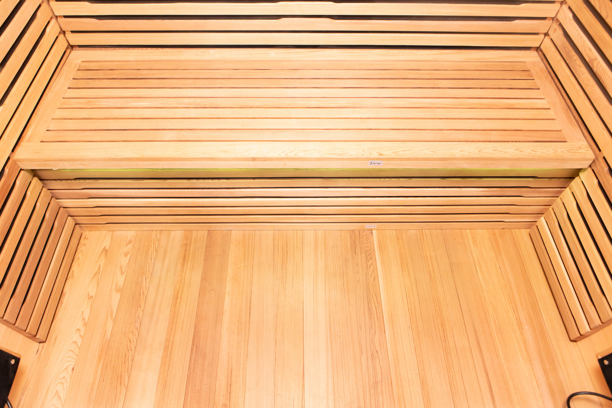 Outdoor infrared sauna interior with Canadian cedar and LED lighting