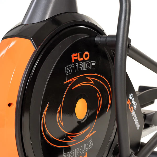 Close-up of a FLO STRIDE exercise bike with orange and black design.