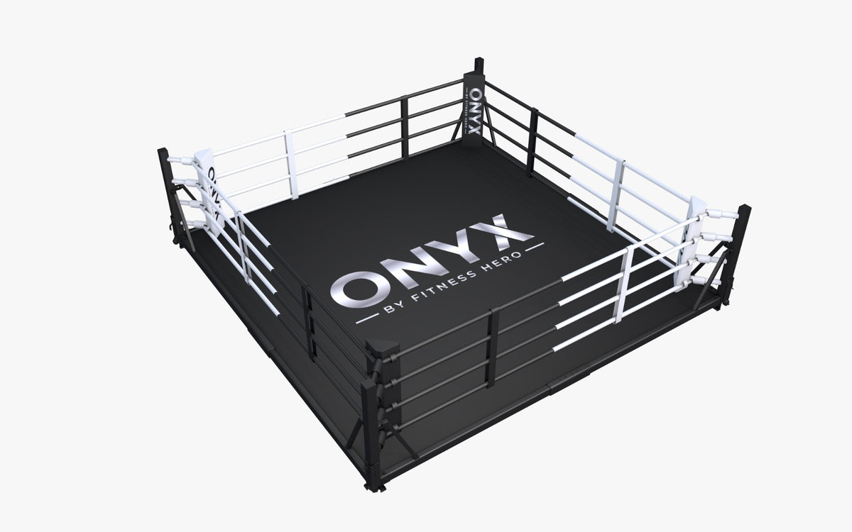 A boxing ring with a black mat featuring the 'ONYX BY FITNESS HERO' logo available in 4 + 5m ring
with or without flooring