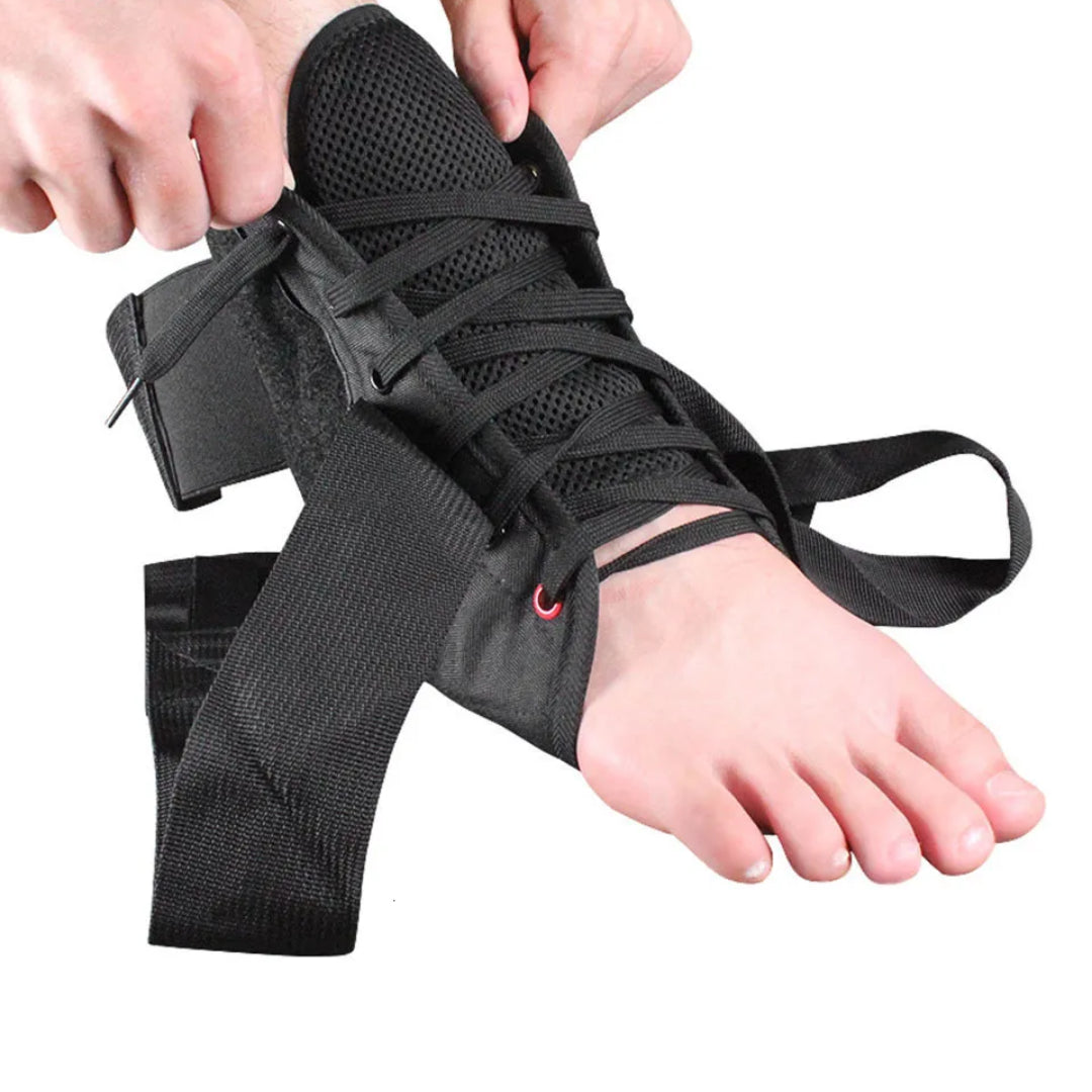 Black ankle support brace being worn on a foot with hands adjusting straps.