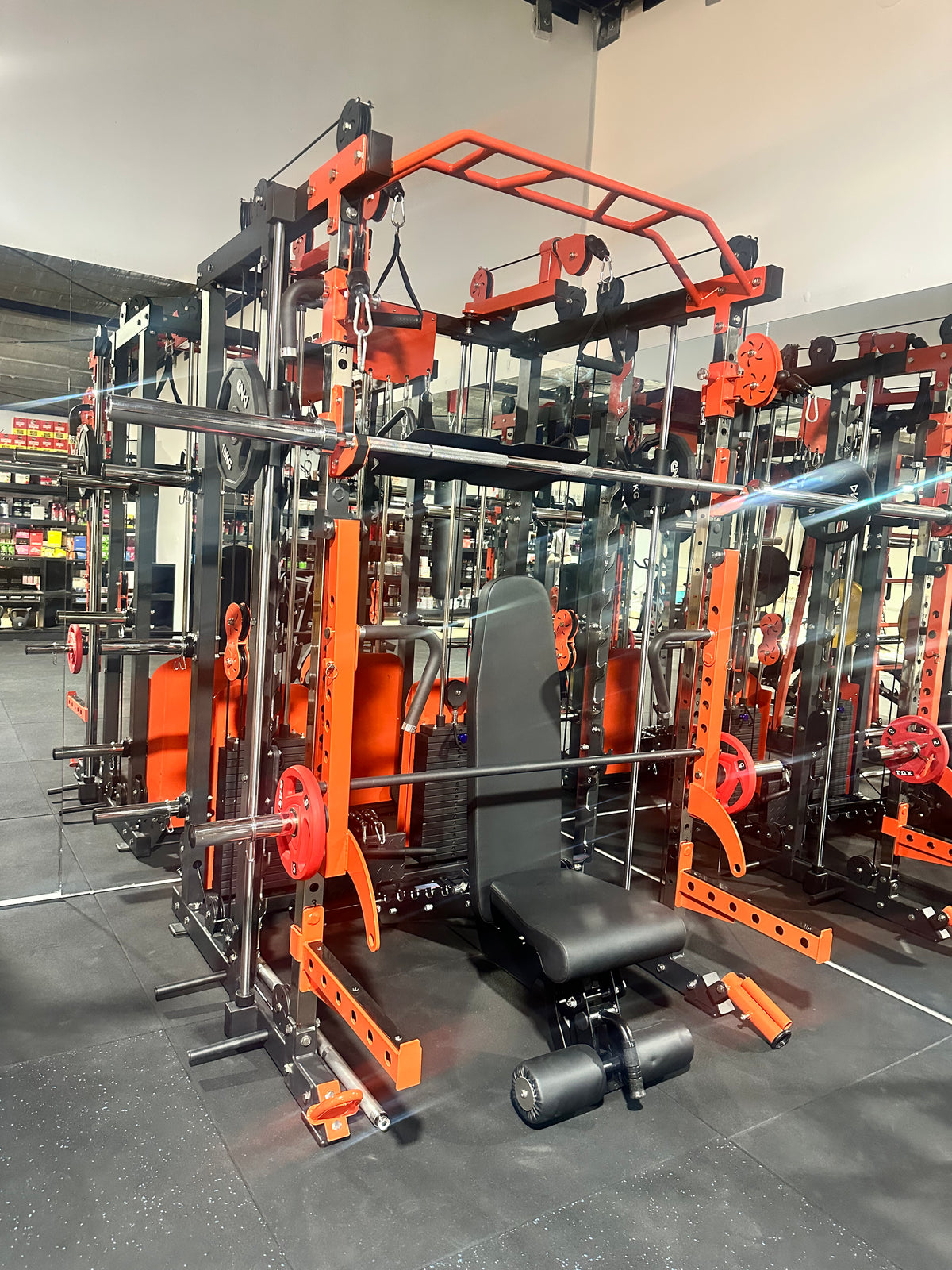 Reload Pro Series Max HD Smith Machine - Commercial-Grade Strength Training Equipment Orange in Fitness Hero Showroom