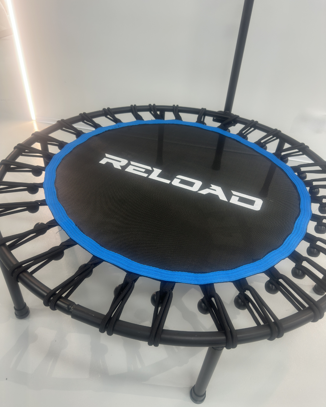 Reload branded rebounder trampoline close-up of jumping surface