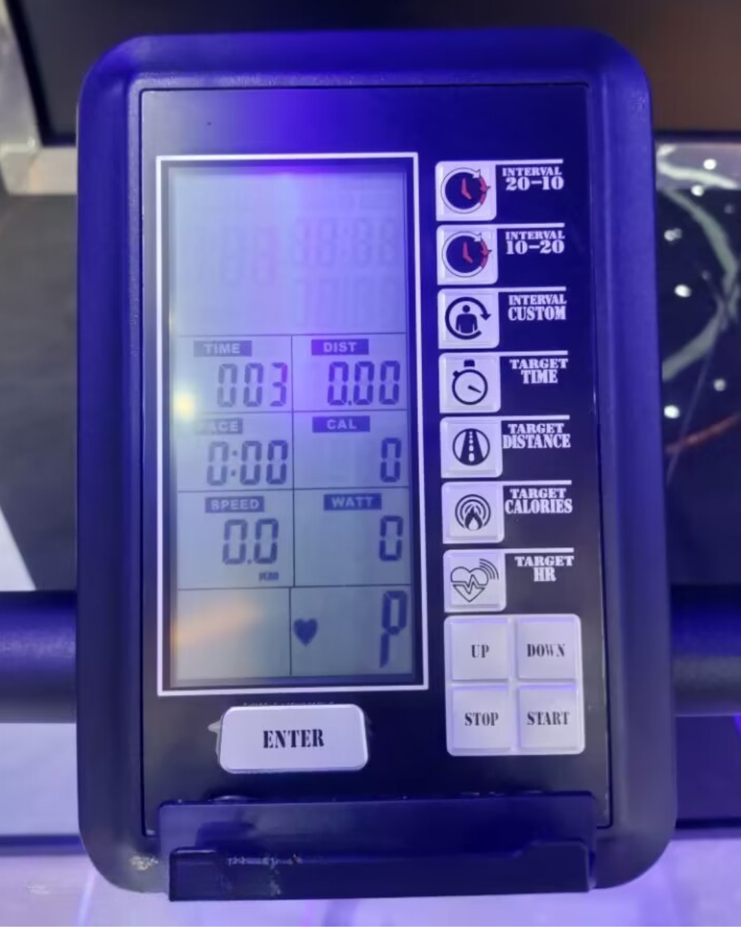 Digital display device with various buttons and indicators for curved treadmill