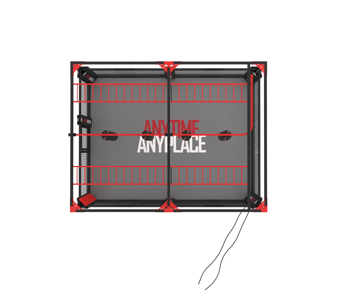 Inside view of MMA cage showing monkey bars and multiple heavy bags suspended from pulleys