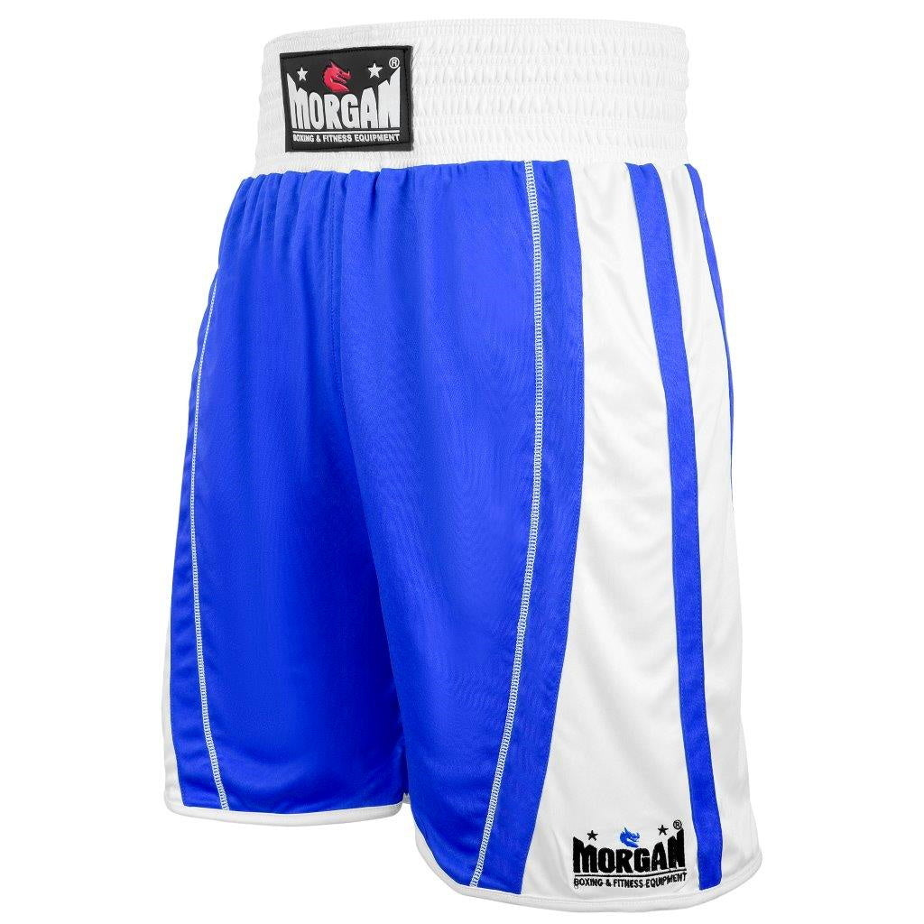 The Fitness Hero reversible boxing shorts by Morgan Sports offer a full 4-inch international style waistband with a snug elastic lining. Cut extra long with hemmed bottoms and its baggy fit makes for a roomier crotch area to accommodate a pro-style cup underneath. Designed with extra-long slits for unmistakable style & made from 100% Polyester