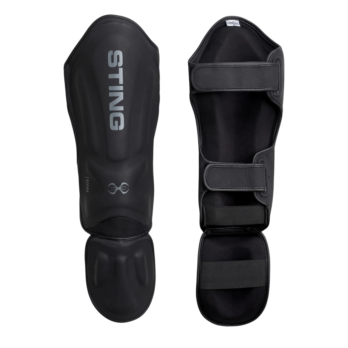 Black shin and foot protectors with adjustable straps and reinforced padding.