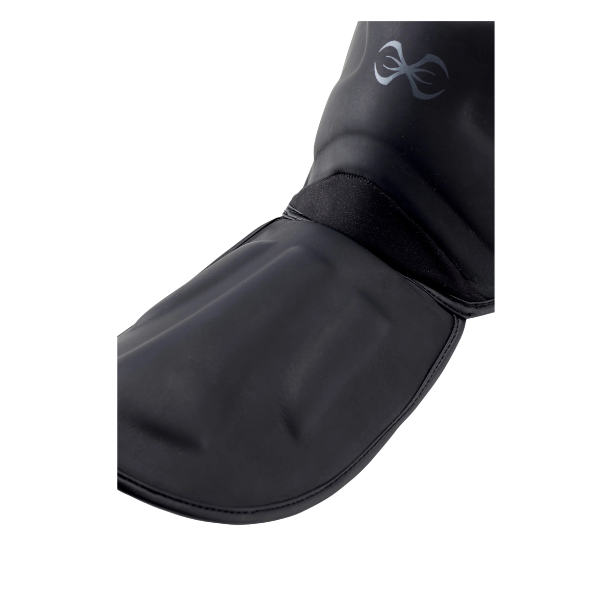 Black shin and foot protectors with adjustable straps and reinforced padding.
