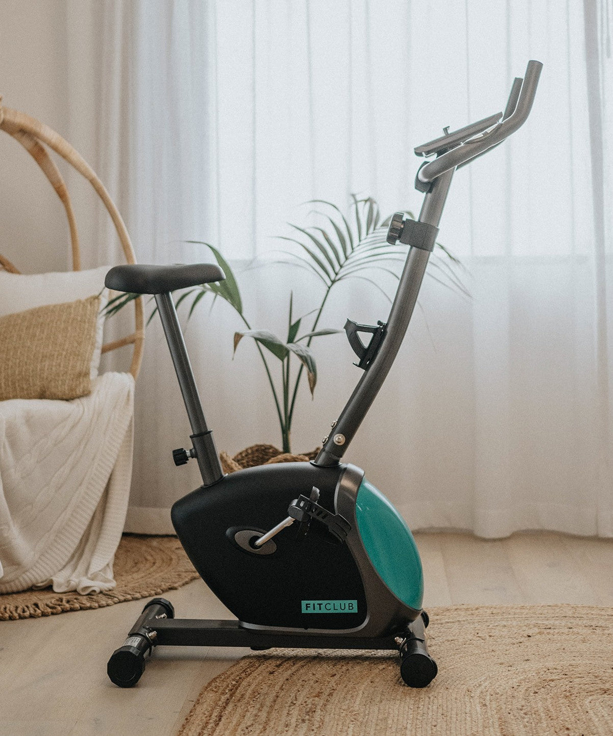 Side view of the compact FitClub Exercise Bike in a home setting