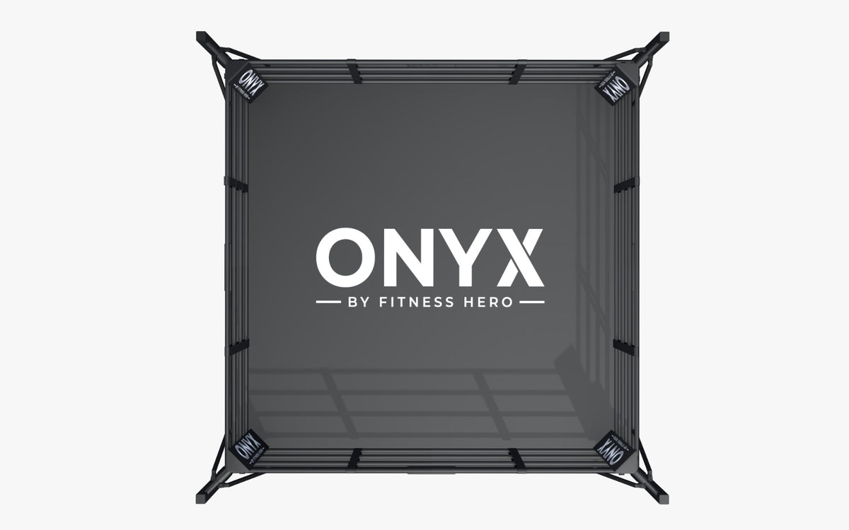 Overhead view of ONYX boxing ring with corner cushions and logo

