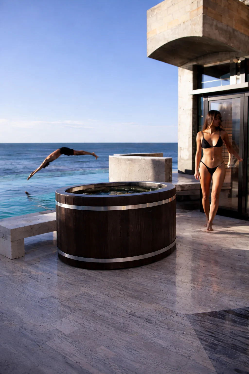 Outdoor ice bath beside pool luxury wellness setup