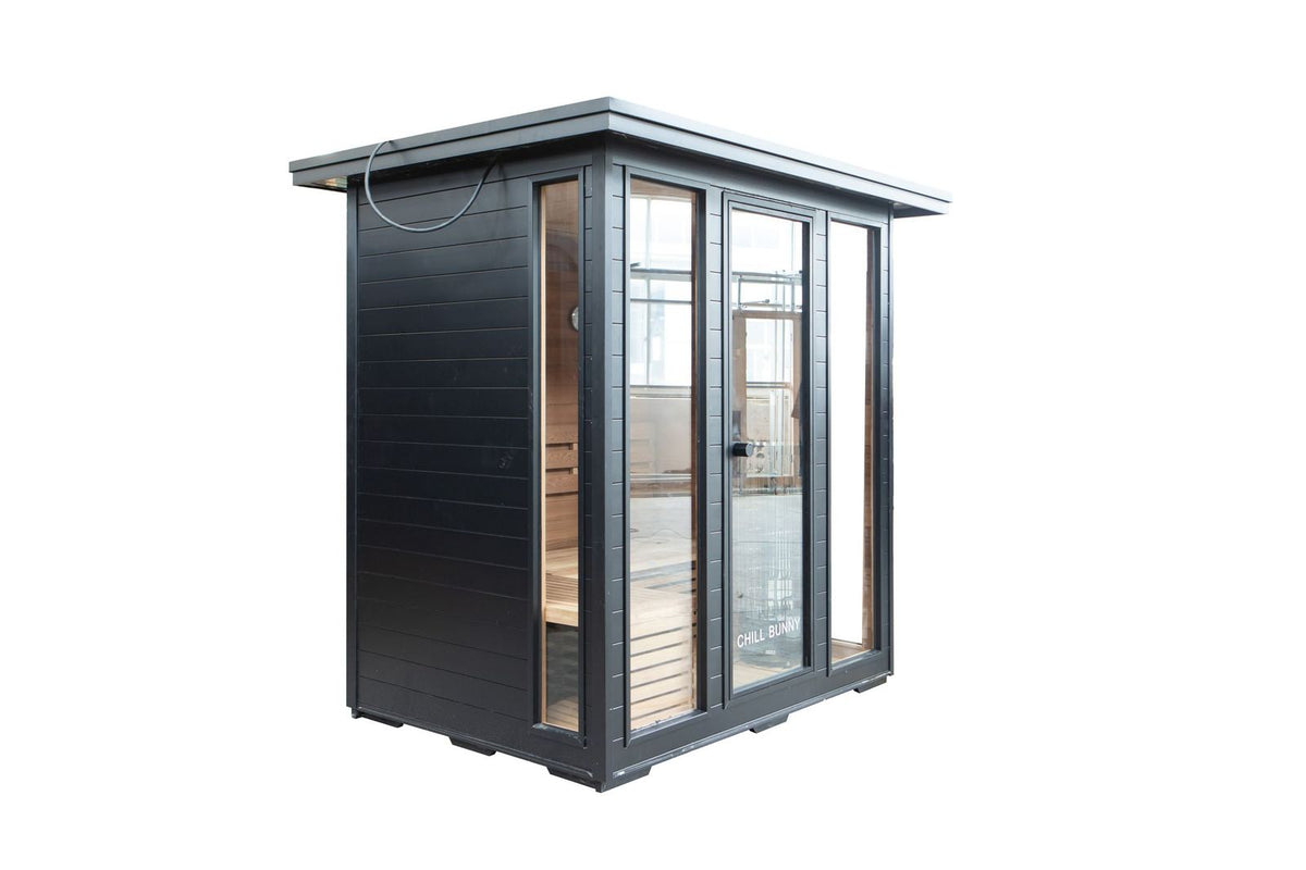 Traditional sauna cedar interior with heated stones and bench seating