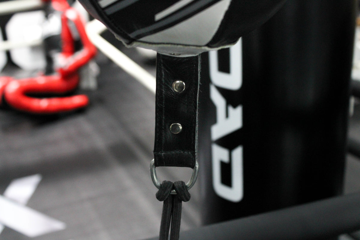 A floor-to-ceiling punch ball is an excellent way for boxers to train their body and enhance their striking power. The Morgan Aventus floor-to-ceiling ball is an essential piece of equipment for improving hand speed, hand-eye coordination, and reaction time.35cm in length and 16cm in diameter. Comes with a rubber bungee cord for adjustability and calibration