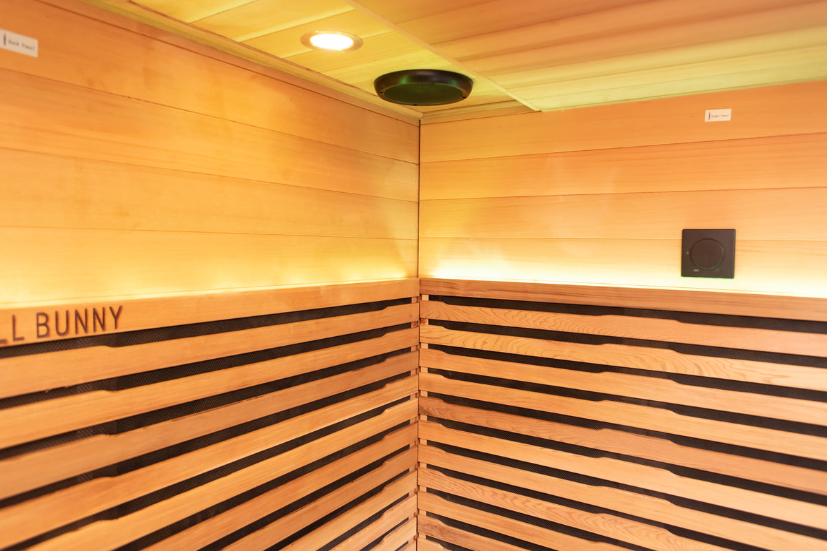 Outdoor infrared sauna interior with Canadian cedar and LED lighting