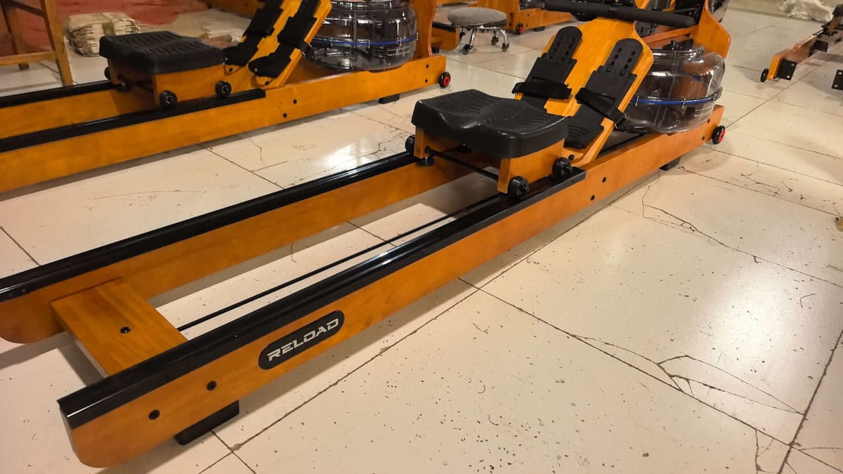 Reload Water Rower showing ergonomic seat, dual rails, and LCD console