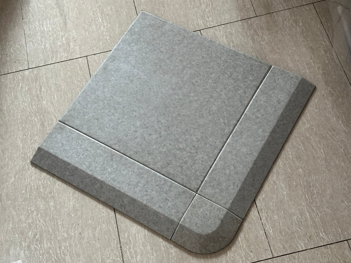 Stone look PVC gym flooring tiles laid with bevelled edge ramp and corner section