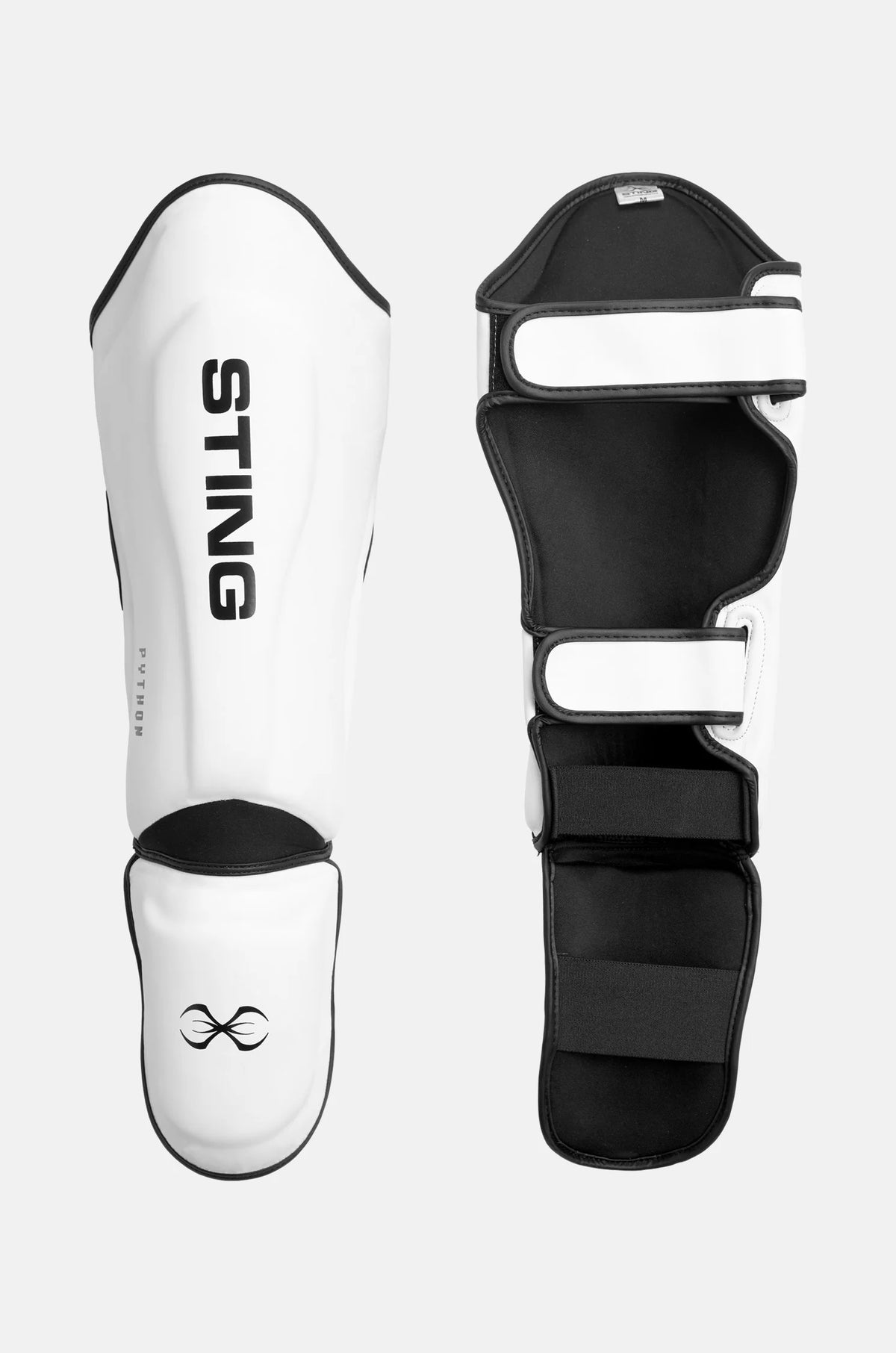 Pair of white and black martial arts shin guards with 'Sting' branding on a light gray background.