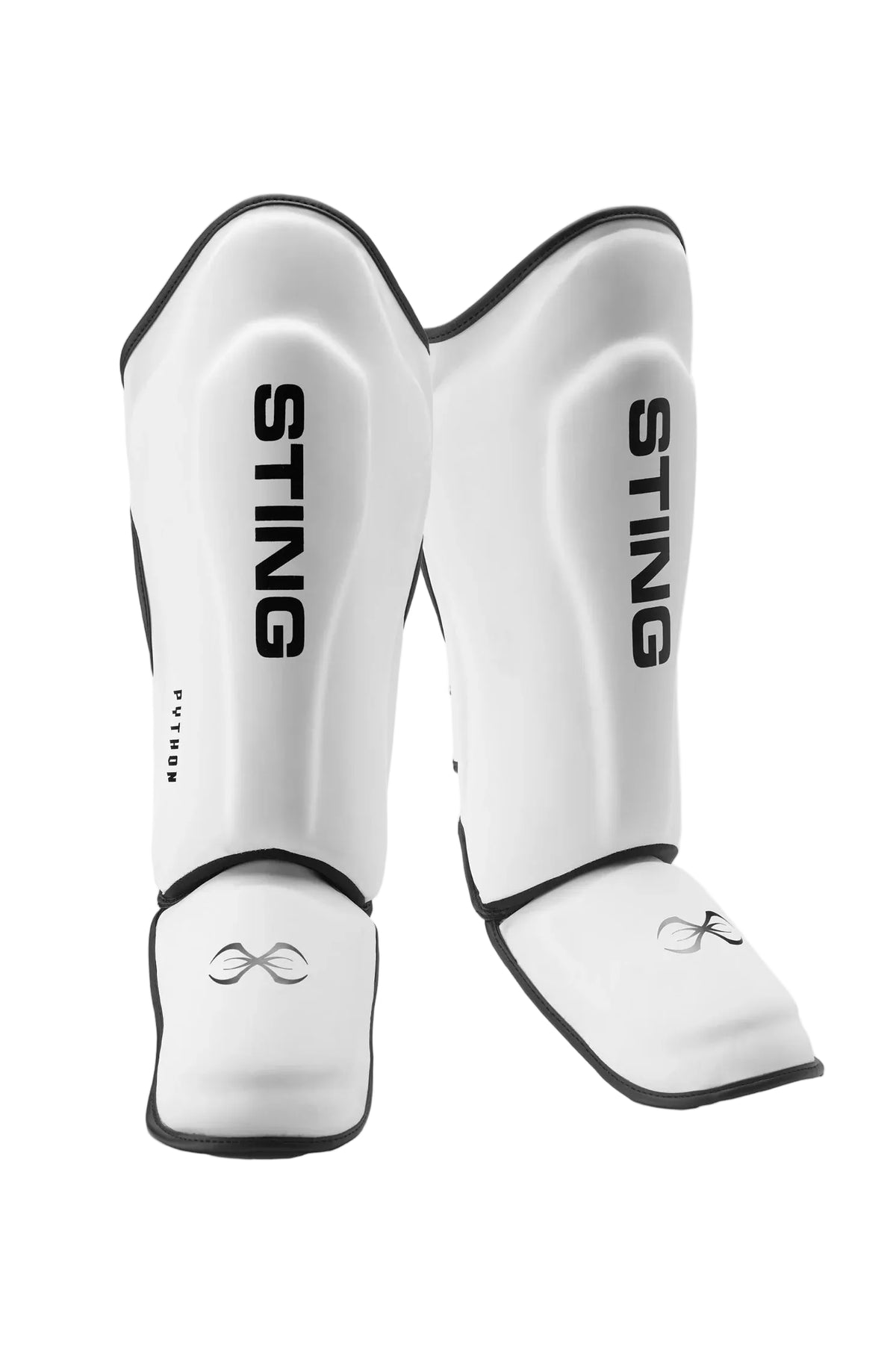 White martial arts shin guards with 'Sting' branding on a light gray background