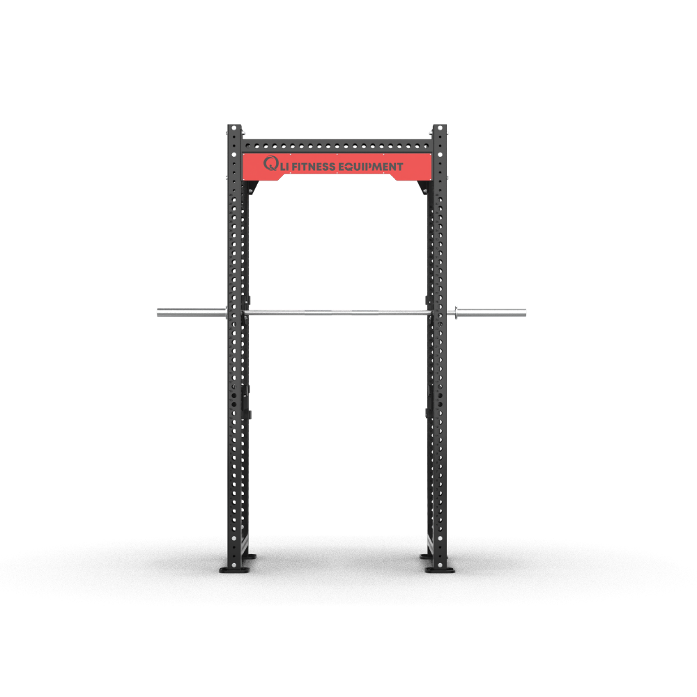 QLI Power Rack QPR158 four-post rack with red branded crossmember, racked barbell, J-hooks and spotter arms