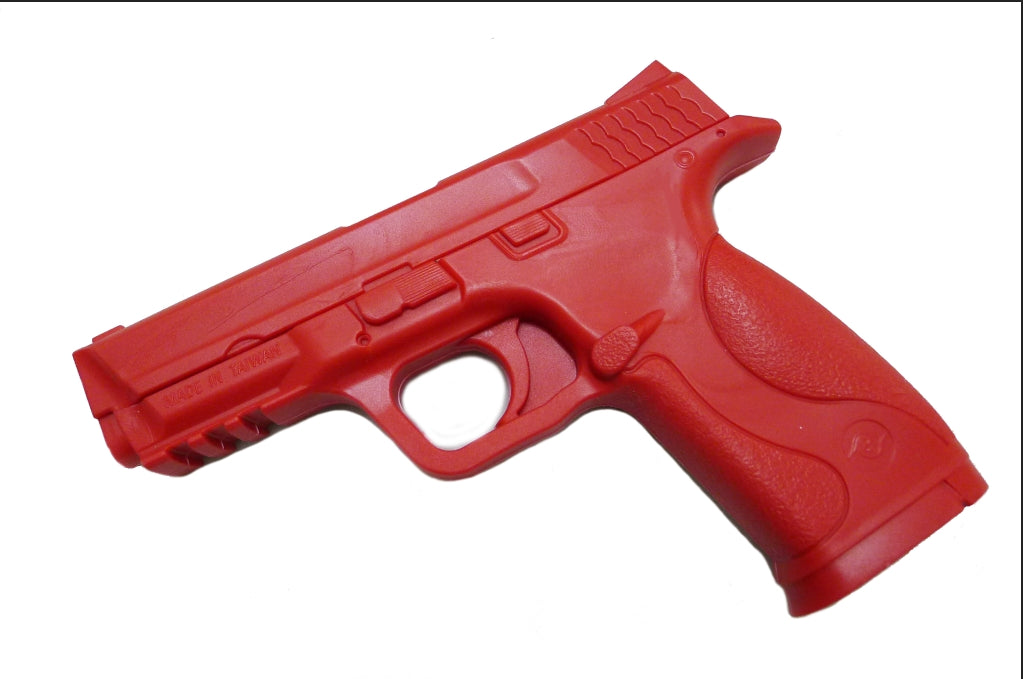 Red plastic gun on a white background