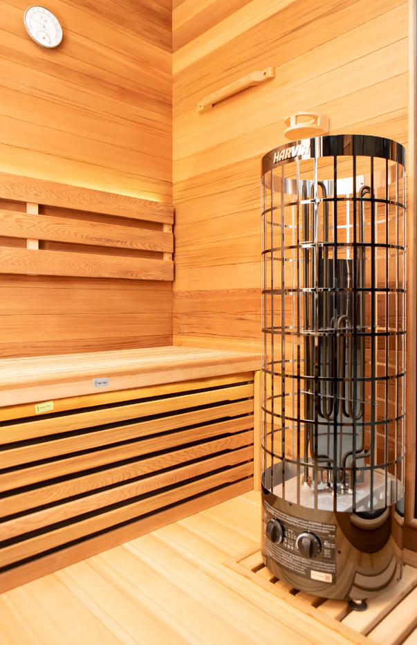 Chill bunny sauna with wooden interior and glass-enclosed heating element.