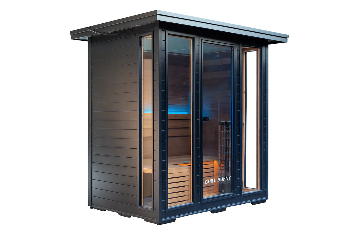 Traditional sauna cedar interior with heated stones and bench seating