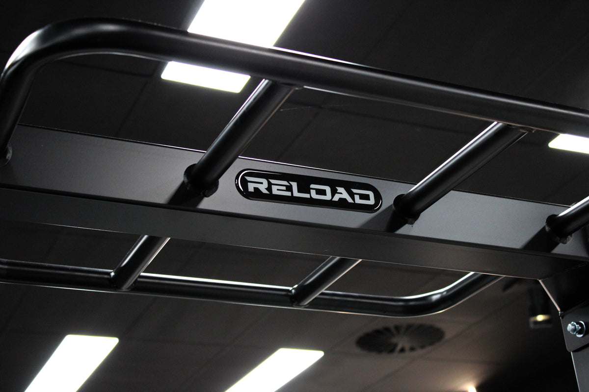 Reload Pro Series power rack - J-hooks and adjustable spotter arms on the upright