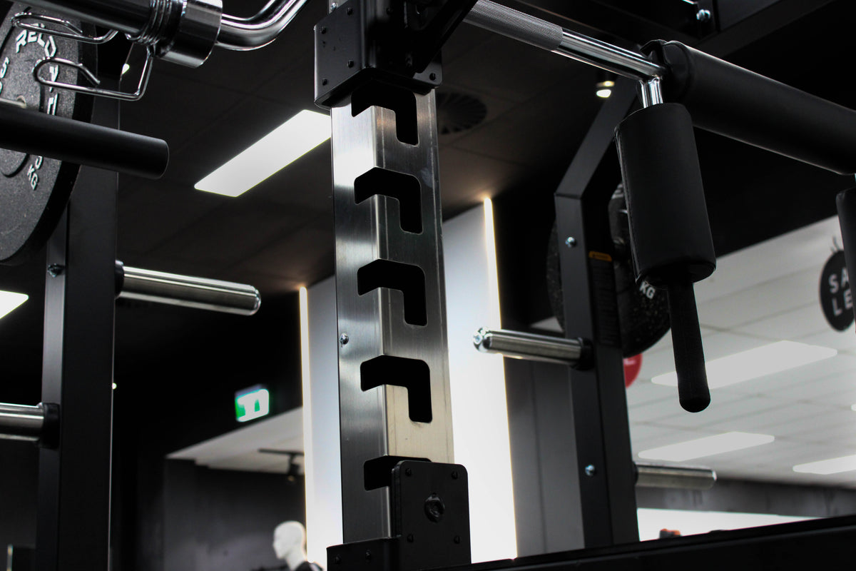 Reload Pro Series power rack - multi-grip pull-up bar and weight plate storage tubes