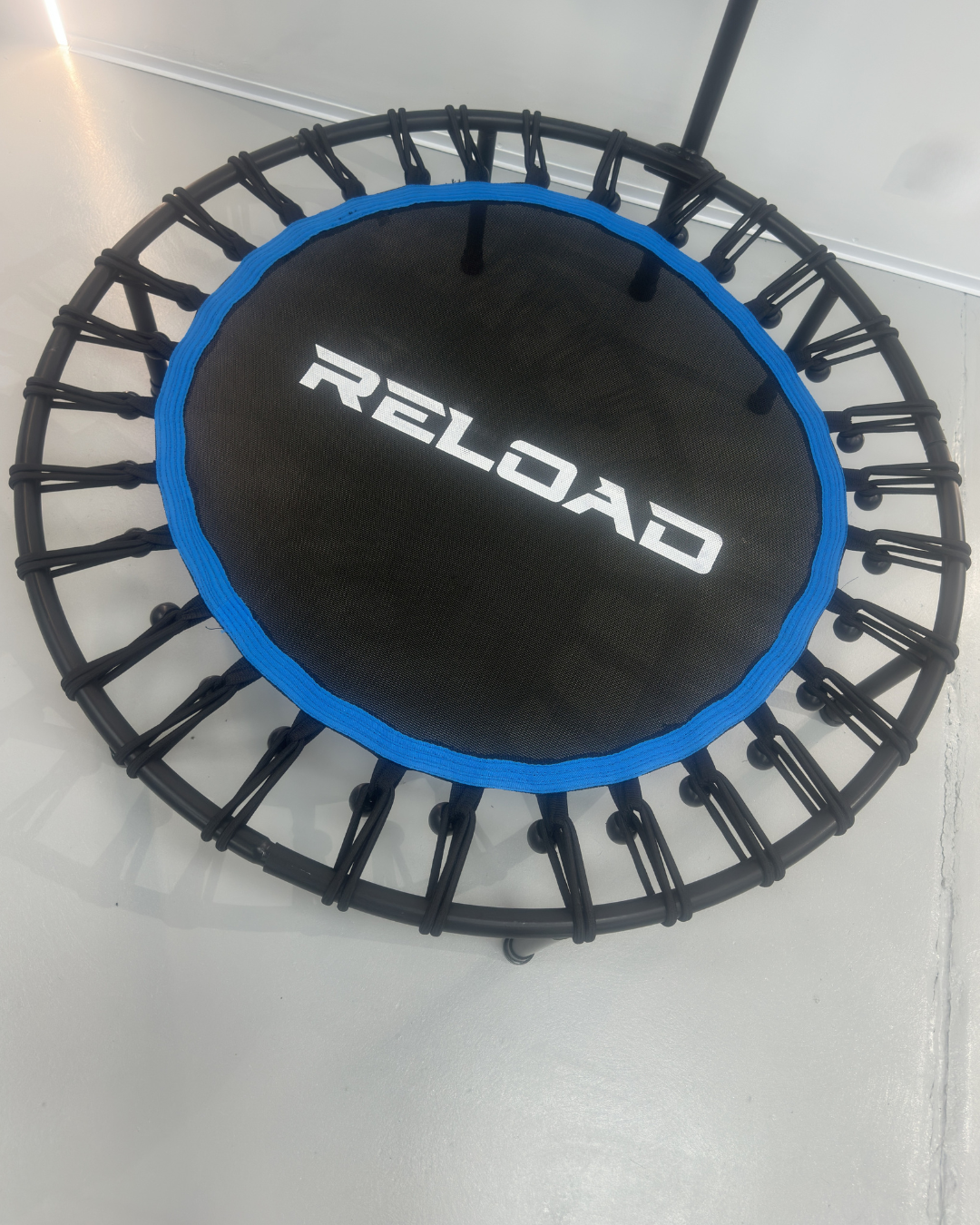 Round mini trampoline rebounder for low-impact cardio training