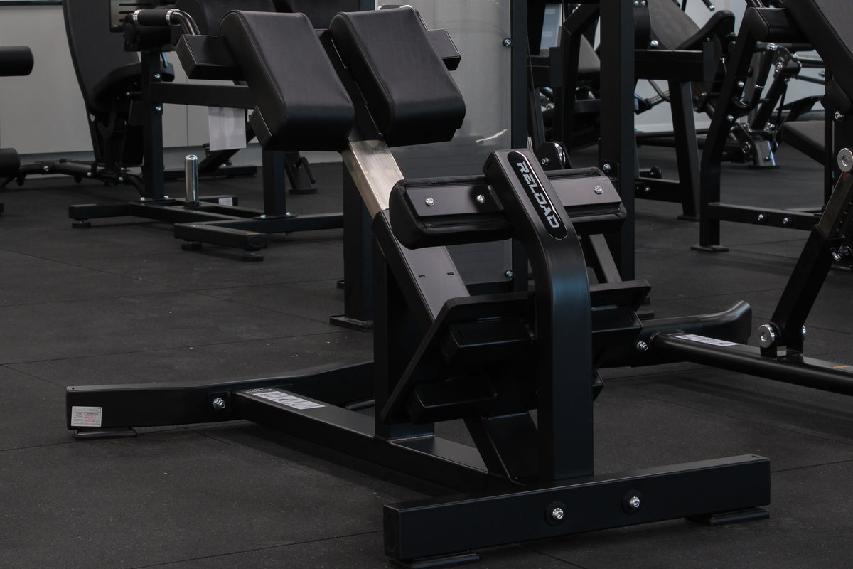 Commercial hyperextension bench with adjustable foot support"
