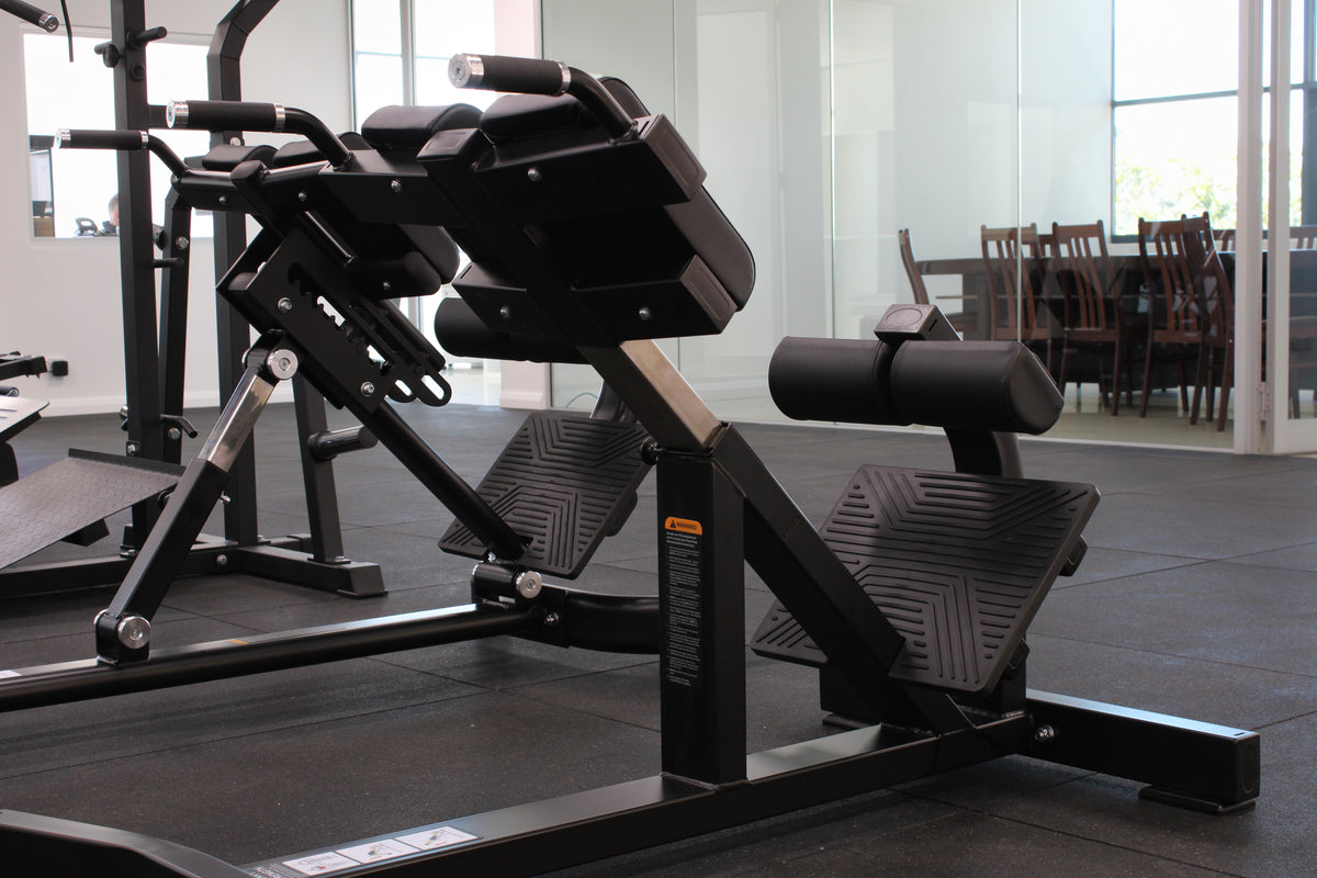 Commercial hyperextension bench with adjustable foot support"
