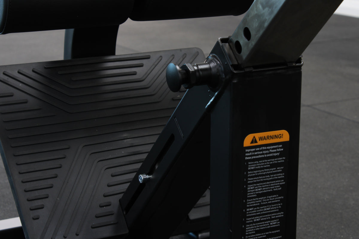 Commercial hyperextension bench with adjustable foot support"
