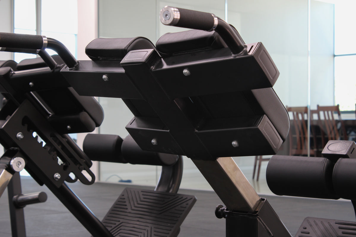 Commercial hyperextension bench with adjustable foot support"
