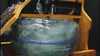 Reload Water Rower on gym floor showing ergonomic seat, dual rails, and LCD console