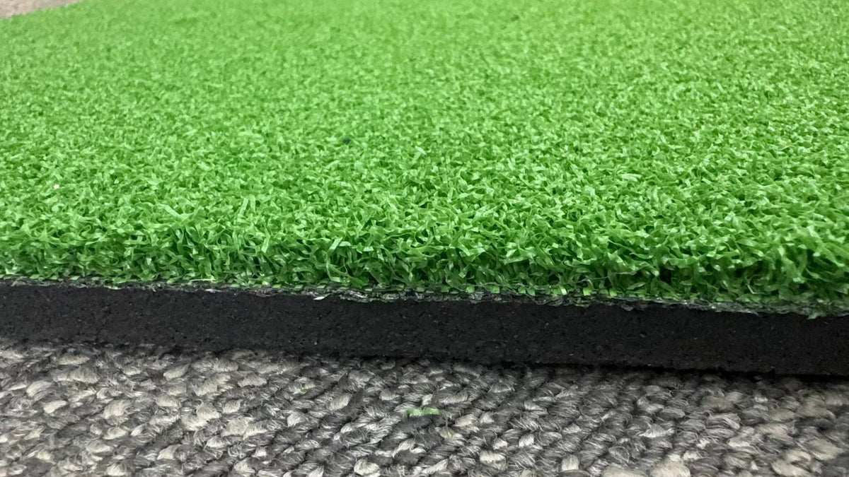 Closeup of hybrid rubber flooring with turf top