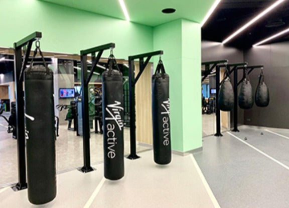 steel floor-mounted bag stand with 250kg capacity for heavy punching bags in commercial gym