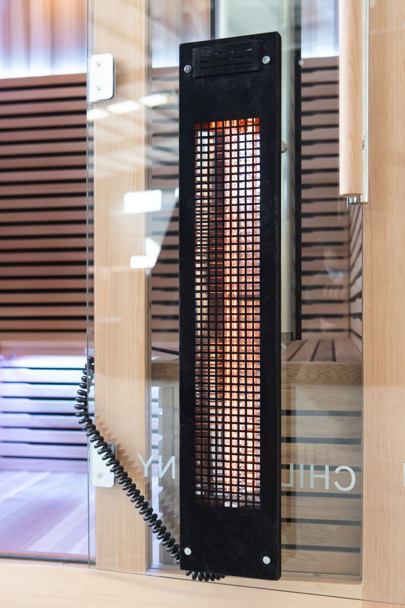 Full spectrum infrared heater panel inside Canadian cedar sauna
