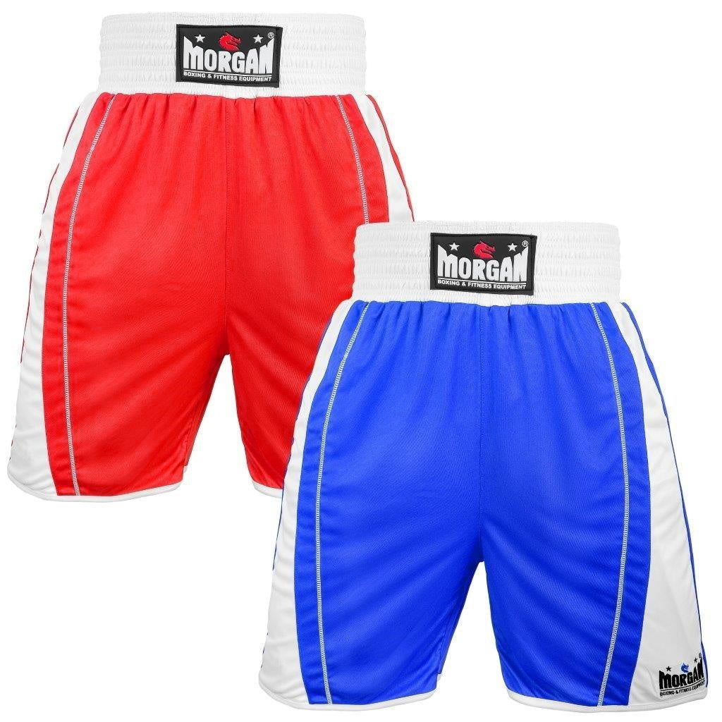 The Fitness Hero reversible boxing shorts by Morgan Sports offer a full 4-inch international style waistband with a snug elastic lining. Cut extra long with hemmed bottoms and its baggy fit makes for a roomier crotch area to accommodate a pro-style cup underneath. Designed with extra-long slits for unmistakable style & made from 100% Polyester
